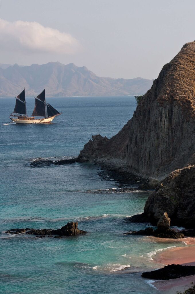 Sailboat cruising clear water during a luxury yacht charter thailand itinerary through island destinations